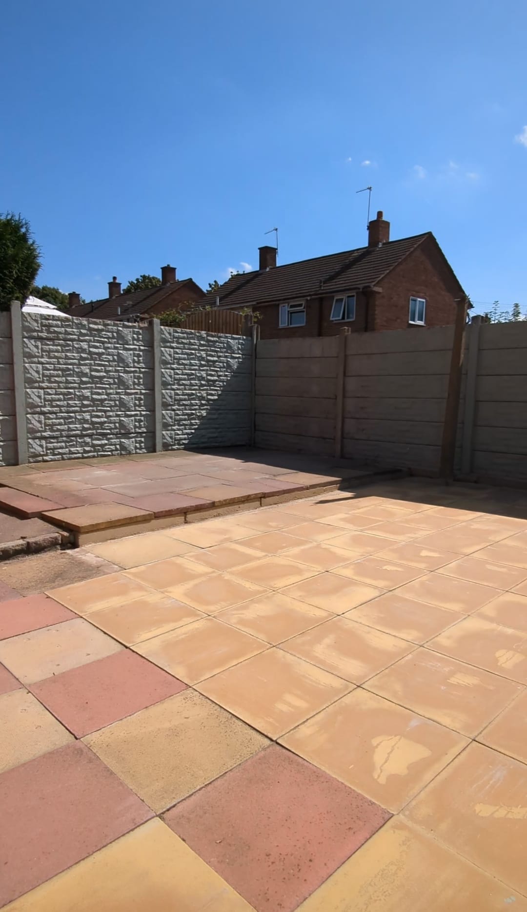 Cleared paved patio following a backyard waste removal project