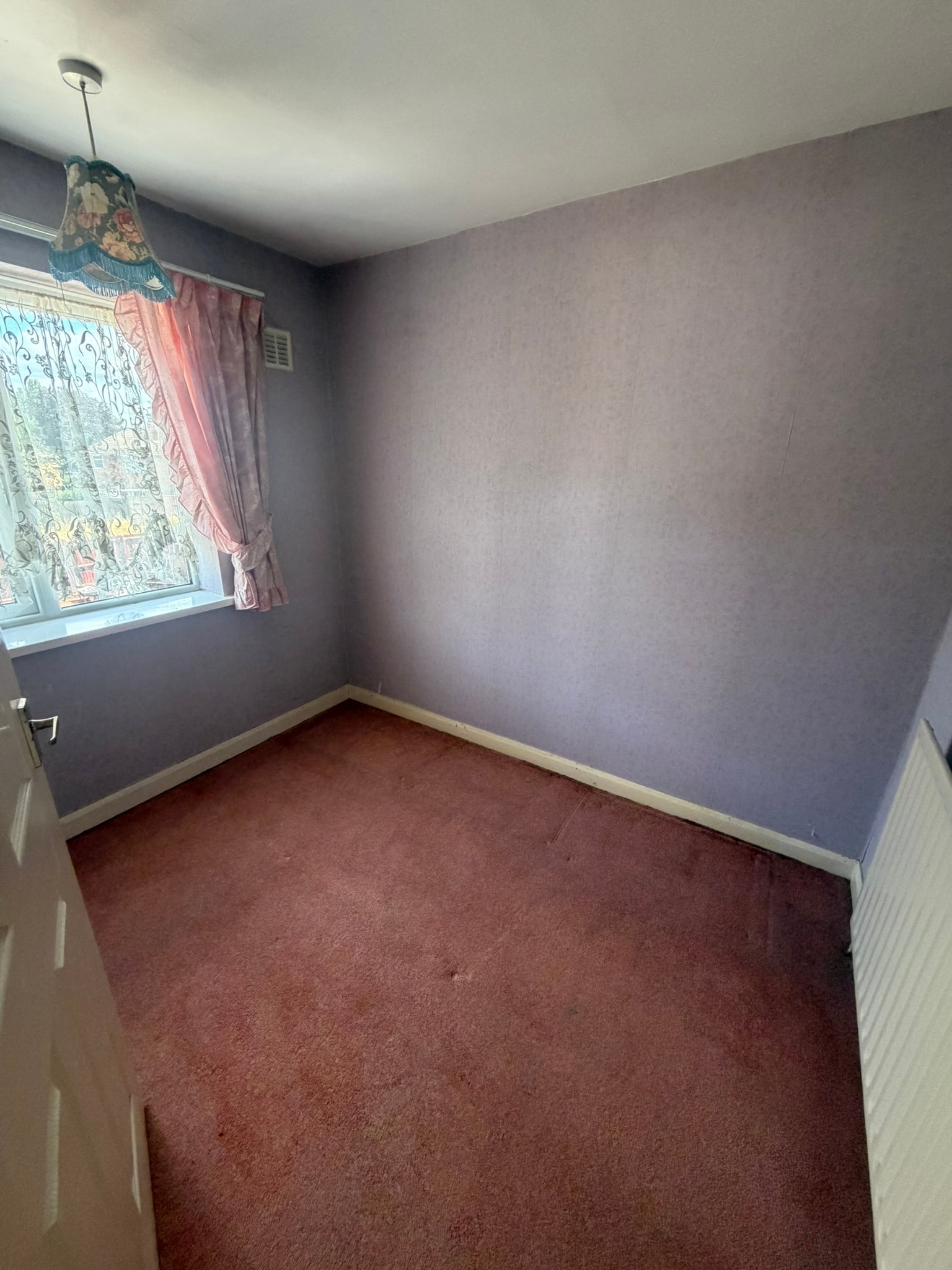Empty bedroom after a house-clearance project